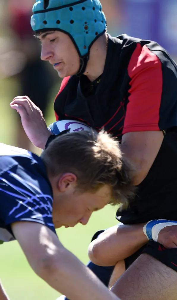 Kids Contact Rugby Training Two young players go in for a tackle against the opposition
