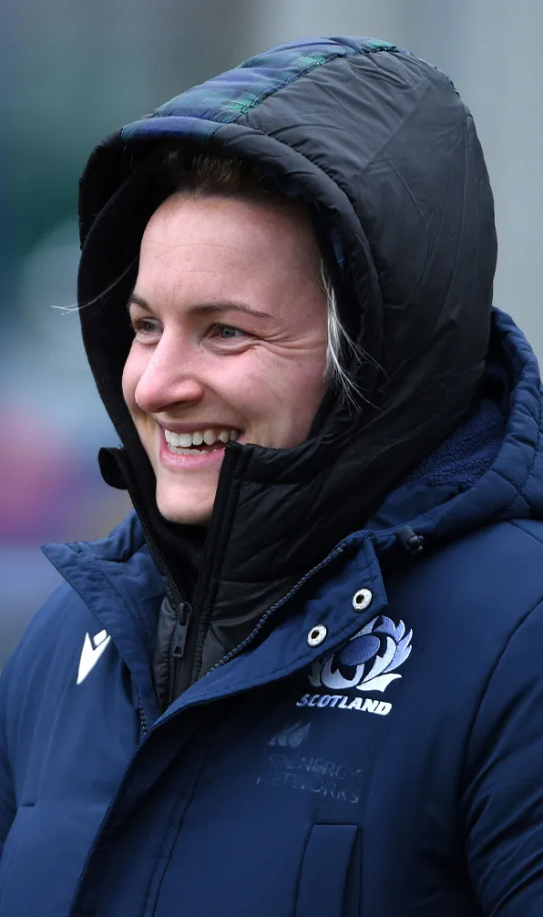 Womens Jackets, Fleeces & Gilets Female rugby player keeping warm at training with the hood up on her jacket