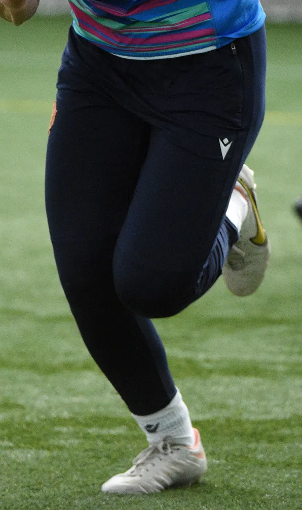 Womens Bottoms & Trousers Female rugby player running on the trining pitch wearing her track pants