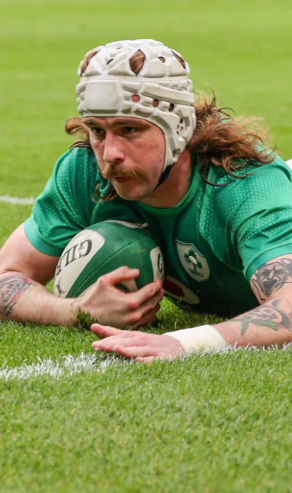 Mens Rugby Headguards Male rugby player scoring a try wearing a headguard for protection