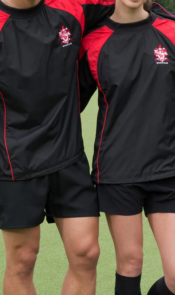 Teamwear Contact Training Tops Team mater overlook the training field wearing black and red rugby contact tops with the club crest embroidered on the front