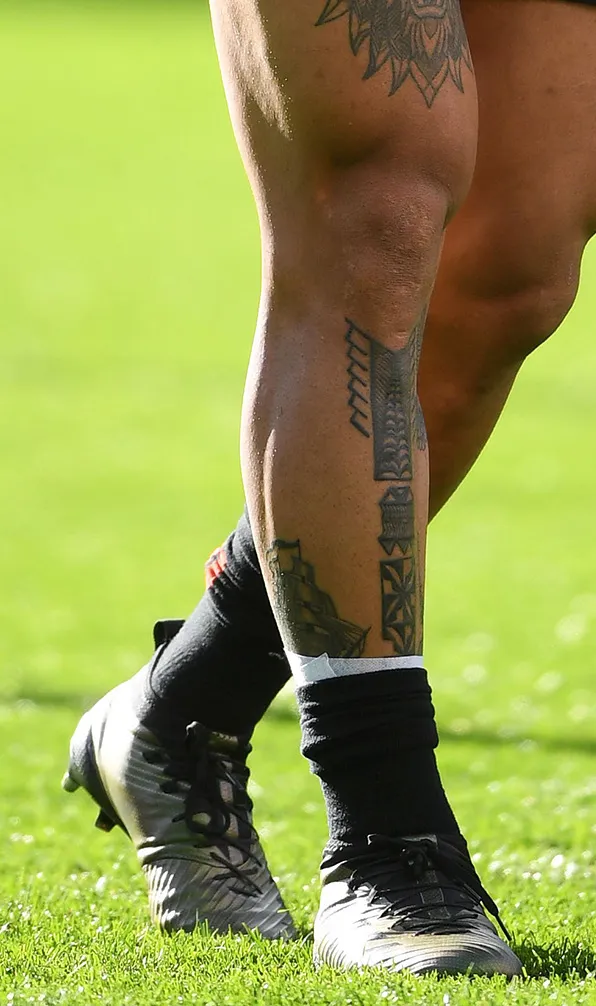 Adults Rugby Boots A player form the New Zealand All Black mens team showing they're new Adidas rugby boots on pitch