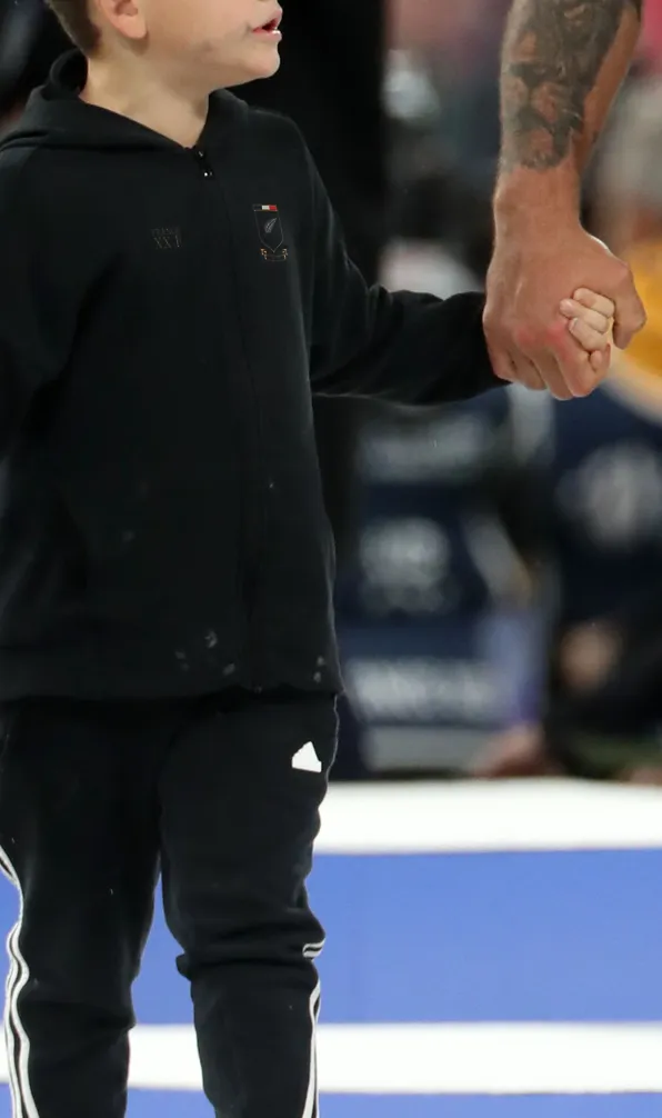 Kids Classics Categories Son of All Blacks player walks alongside his dad after Rugby match