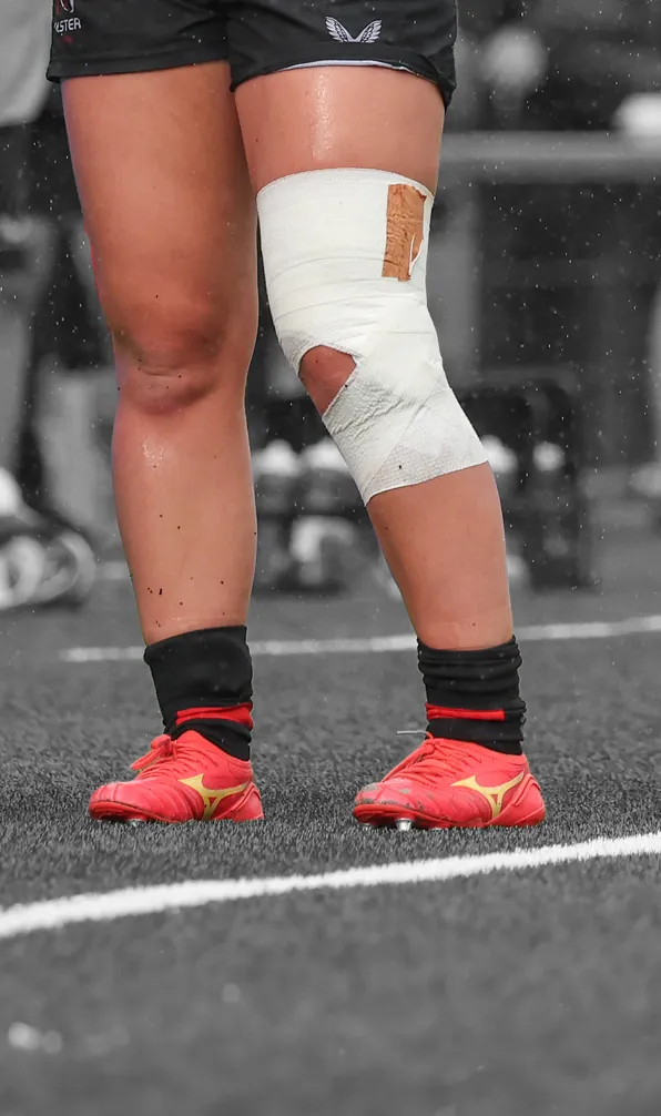 Shop Club Boots Now Close up of female rugby player wearing Mizuno boots