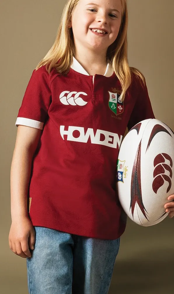 Kids Rugby Shirts A young British and Irish Lions fan excitedly poses while modelling an official Canterbury Lions shirt