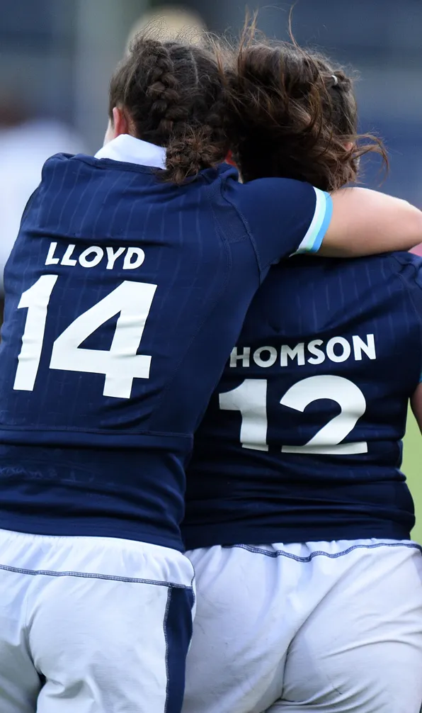 Shop Gifts for Her Now Two female Scotland players hugging each other after a win