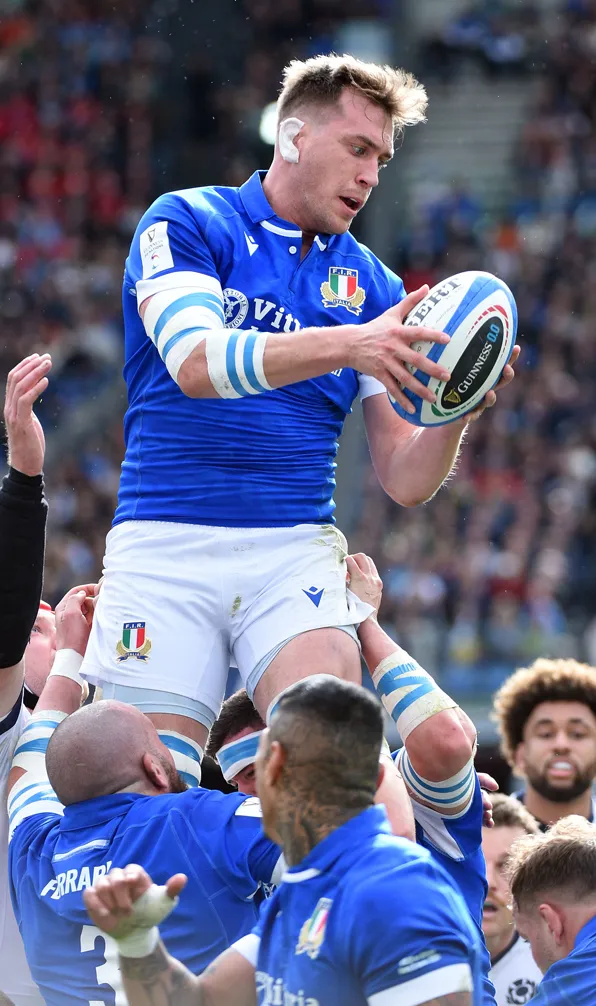Shop International Rugby Sale Now Italy Rugby player gets raised into the air to catch the ball verse Scotland in the Six Nations