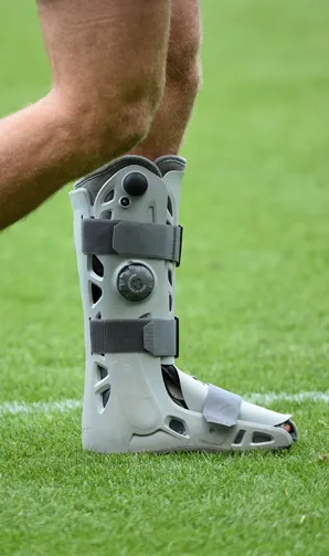 Injury Blogs Injured player wearing a medical boot