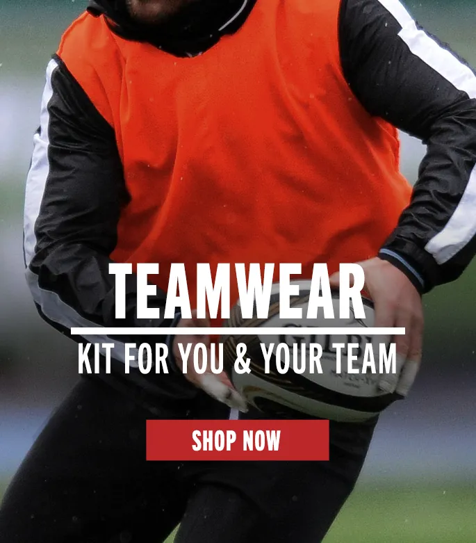 Shop Teamwear Now Player wearing a sports bib and running whilst in training session