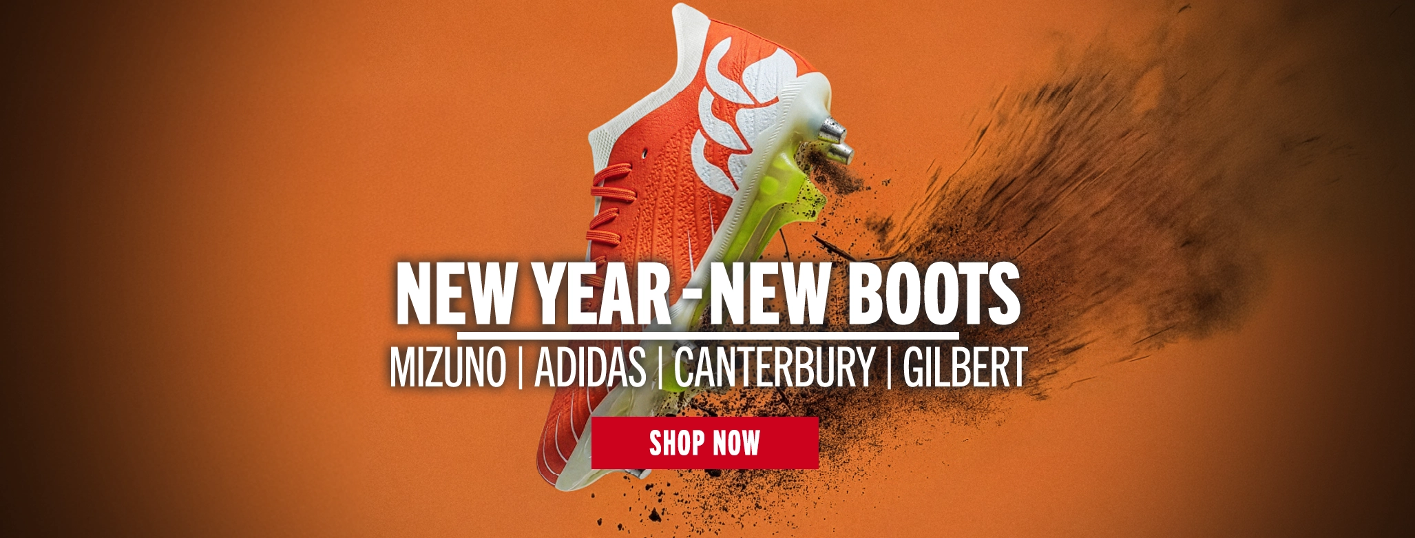 NEW YEAR - NEW BOOTS A orange Canterbury boot bring up dirt as it sits on a orange background.