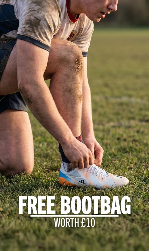 A player tying the laces on his Adidas rugby boots.