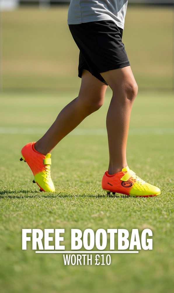 A young player running across the pitch in their pair of Optimum rugby boots.