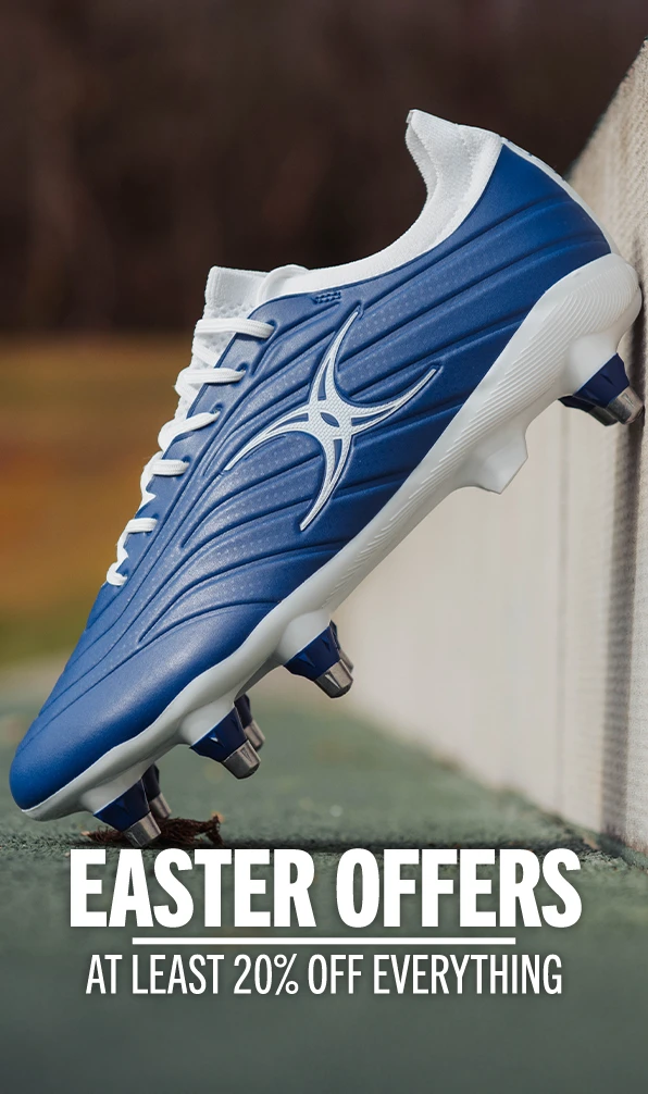 A close up image of a Gilbert rugby boots in blue.