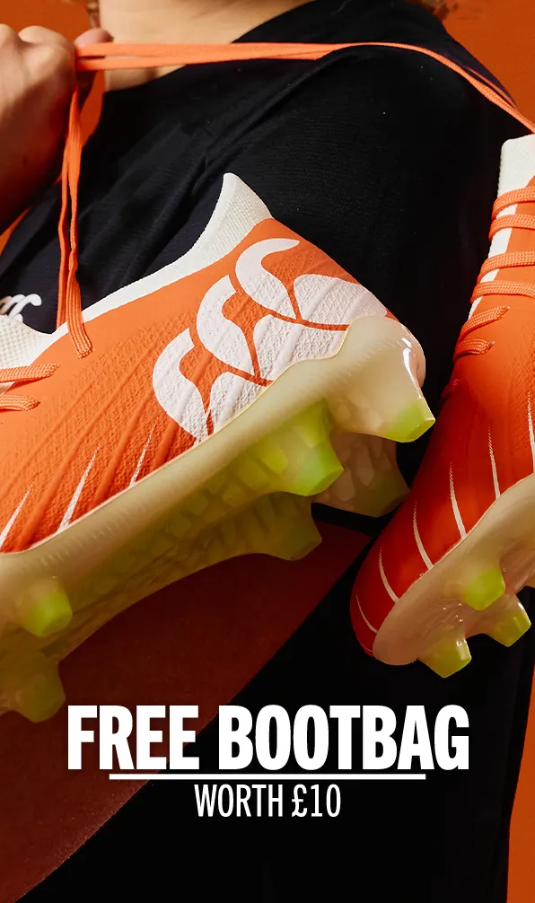 Orange pair of Canterbury rugby boots.