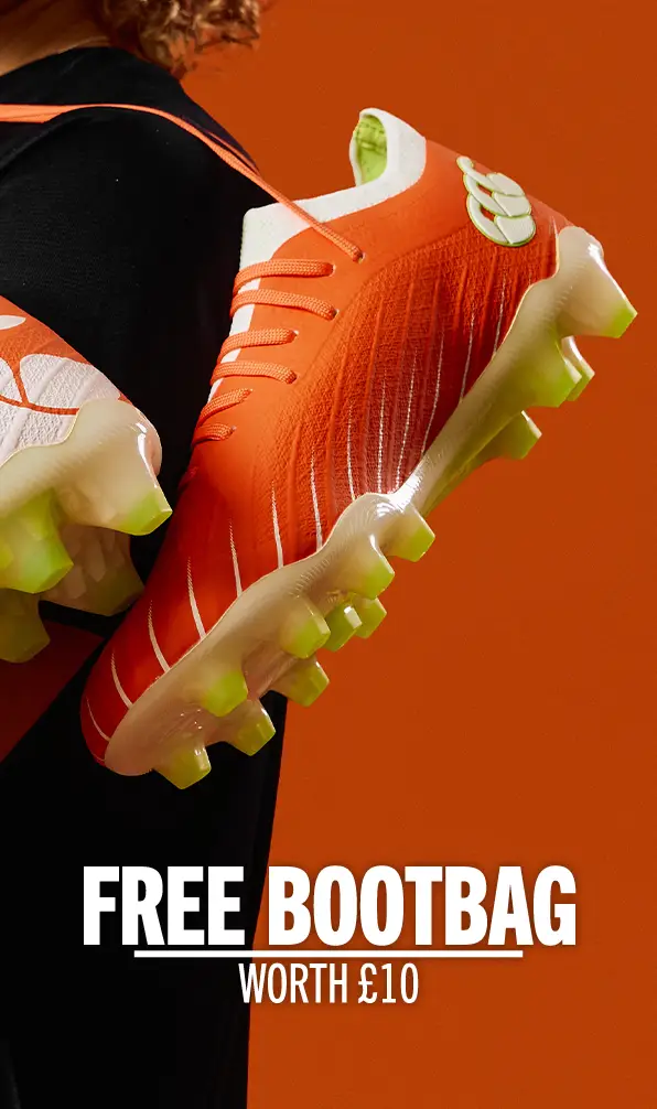 Orange pair of Canterbury rugby boots.