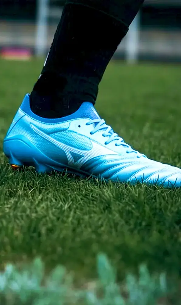 A close up image of a pair of a Mizuno rugby boot in blue.