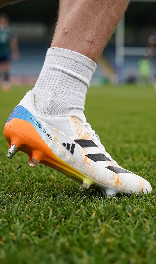 A player in training in their pair of Adidas rugby boots.