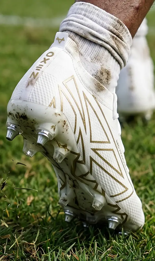 A player on the pitch in a pair of the Oxen Hawkshift rugby boots.