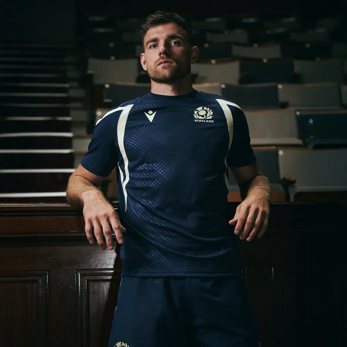 Scotland Training Reveal Ben White stands in a theatre wearing the new Scotland Training T-Shirt.