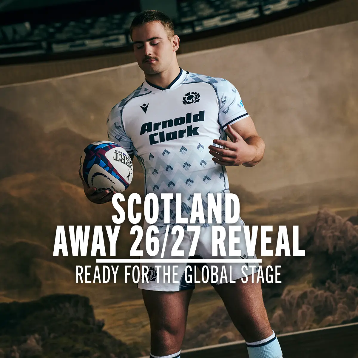A Scotland International stands in the new Scotland 26/27 Away kit with a ball in hand.