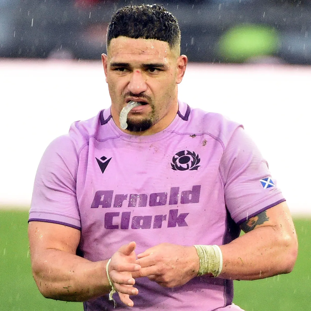 Italy vs Scotland 2026 6 Nations Sione Tuipulotu adjusts his wrist supports in Scotland 6 Nations game against Italy.