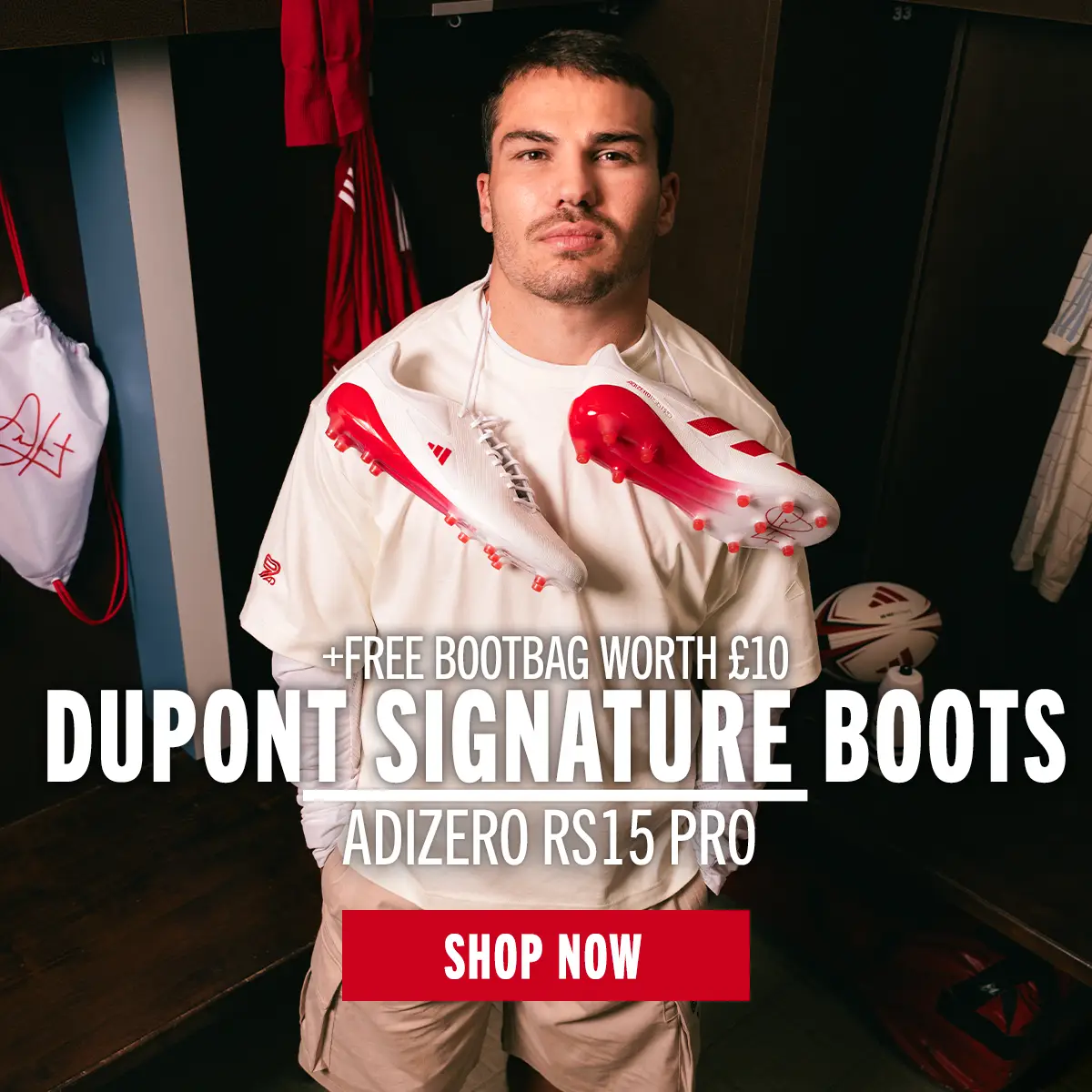 Antoine Dupont stands in a changing room with his new signature rugby boots hanging from his neck.