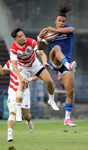 A Japan players loses the arial battle to his Italian opponent.