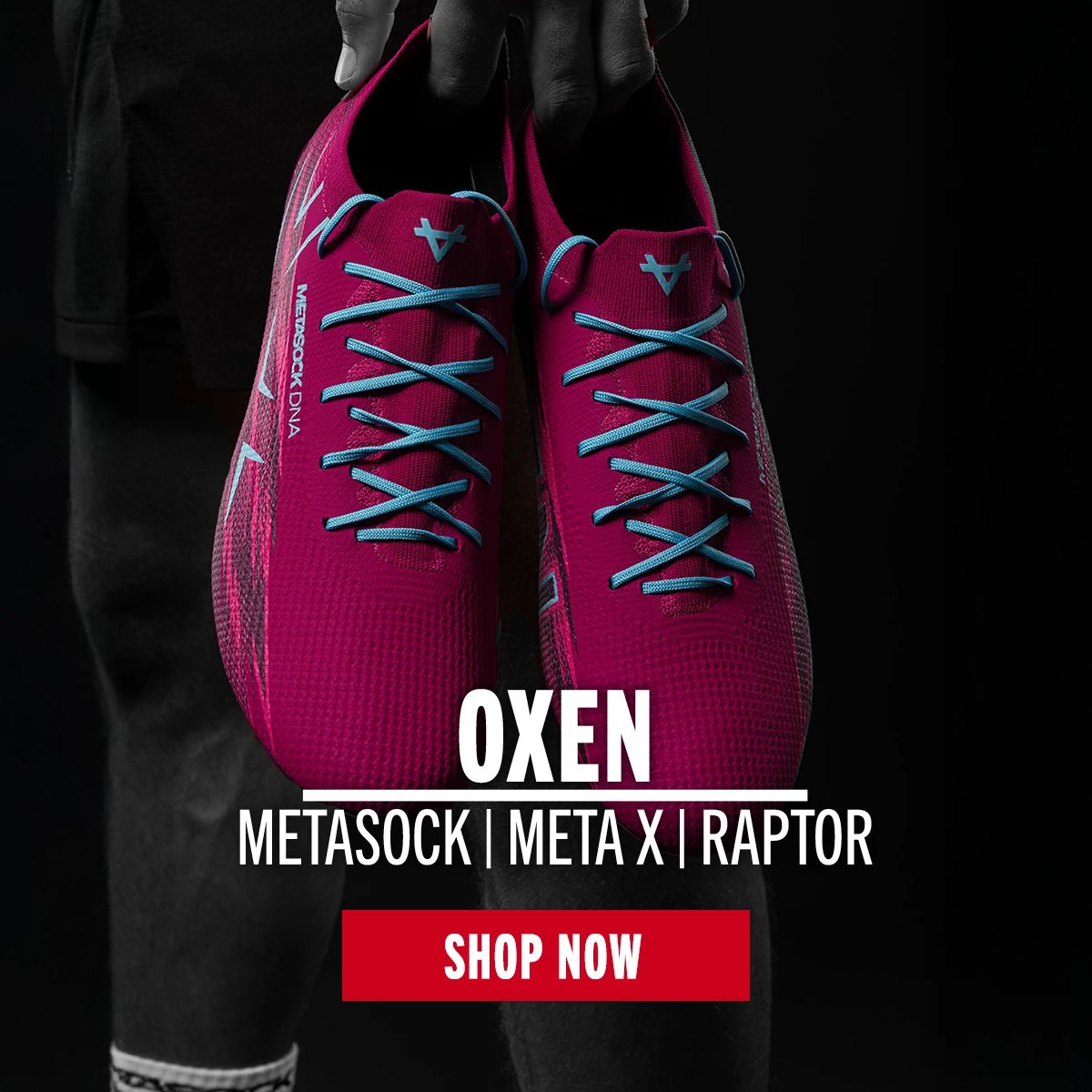 A person is holding a pair of Oxen Metasock rugby boots.