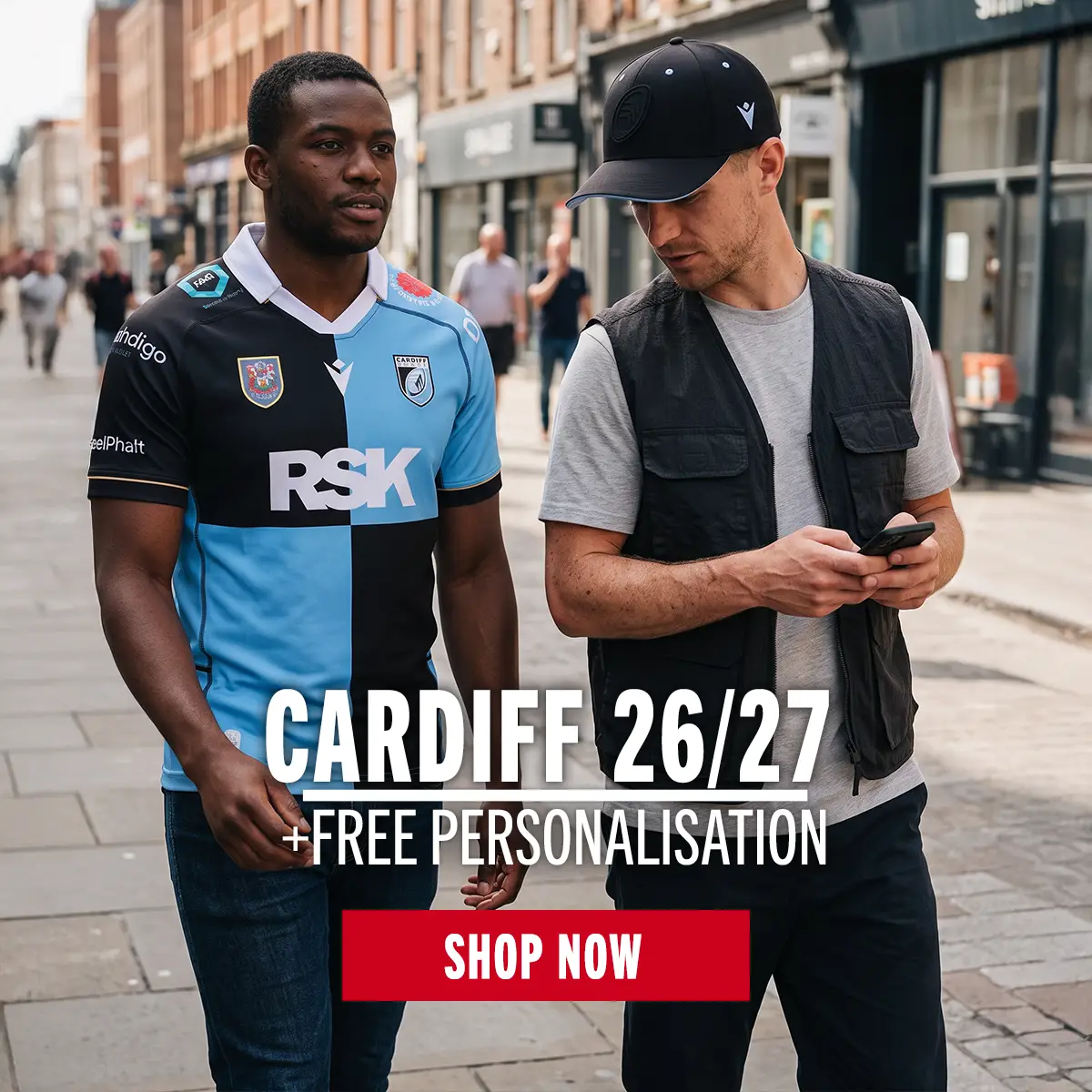 Two men are walking to the game in their new Cardiff kit.