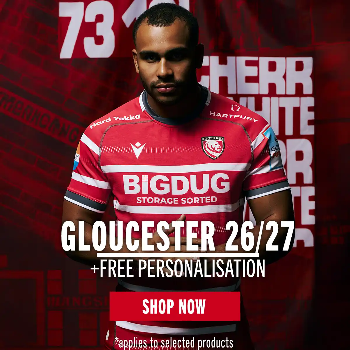 Gloucester 26/27 Range A Gloucester player stands in front of a red mural in the new 26/27 home kit.