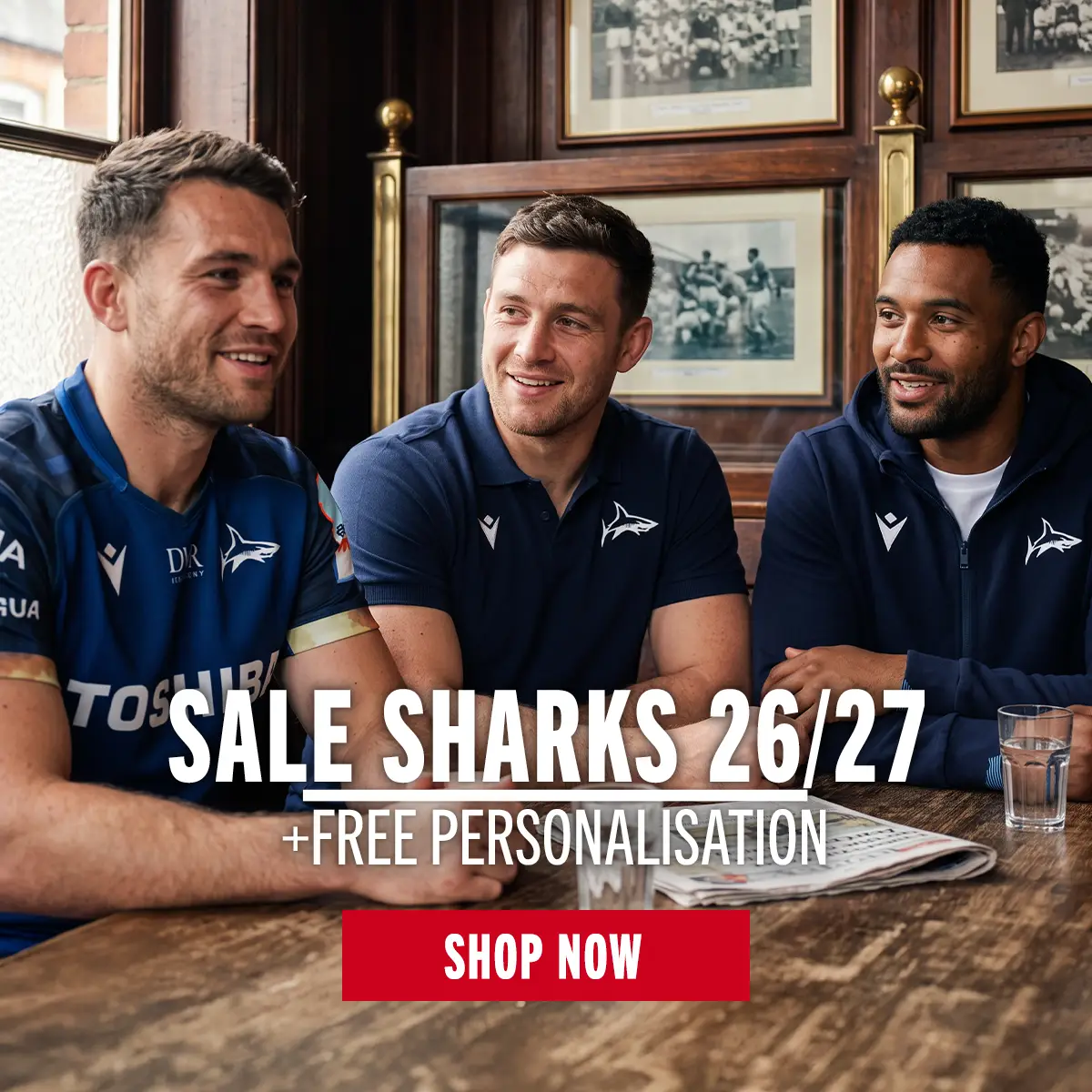 Three men sit in a pub wearing their new Sale Sharks kit.