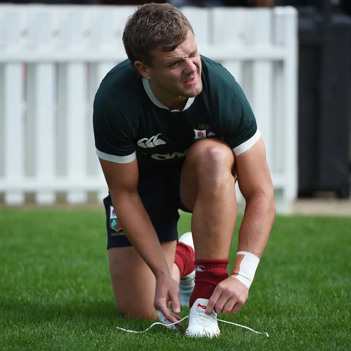 Rugby Boot Fit Guide Photo 3 Scotland's Darcy Graham is tying his Oxen boots when getting ready for Lions training.